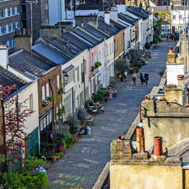 A London street depicting a range of adjoining properties from different periods